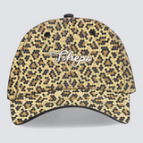A cap with a leopard animal print pattern and an embroidered signature logo on the front.