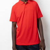 Model wearing the red TSHEPO Golf Shirt