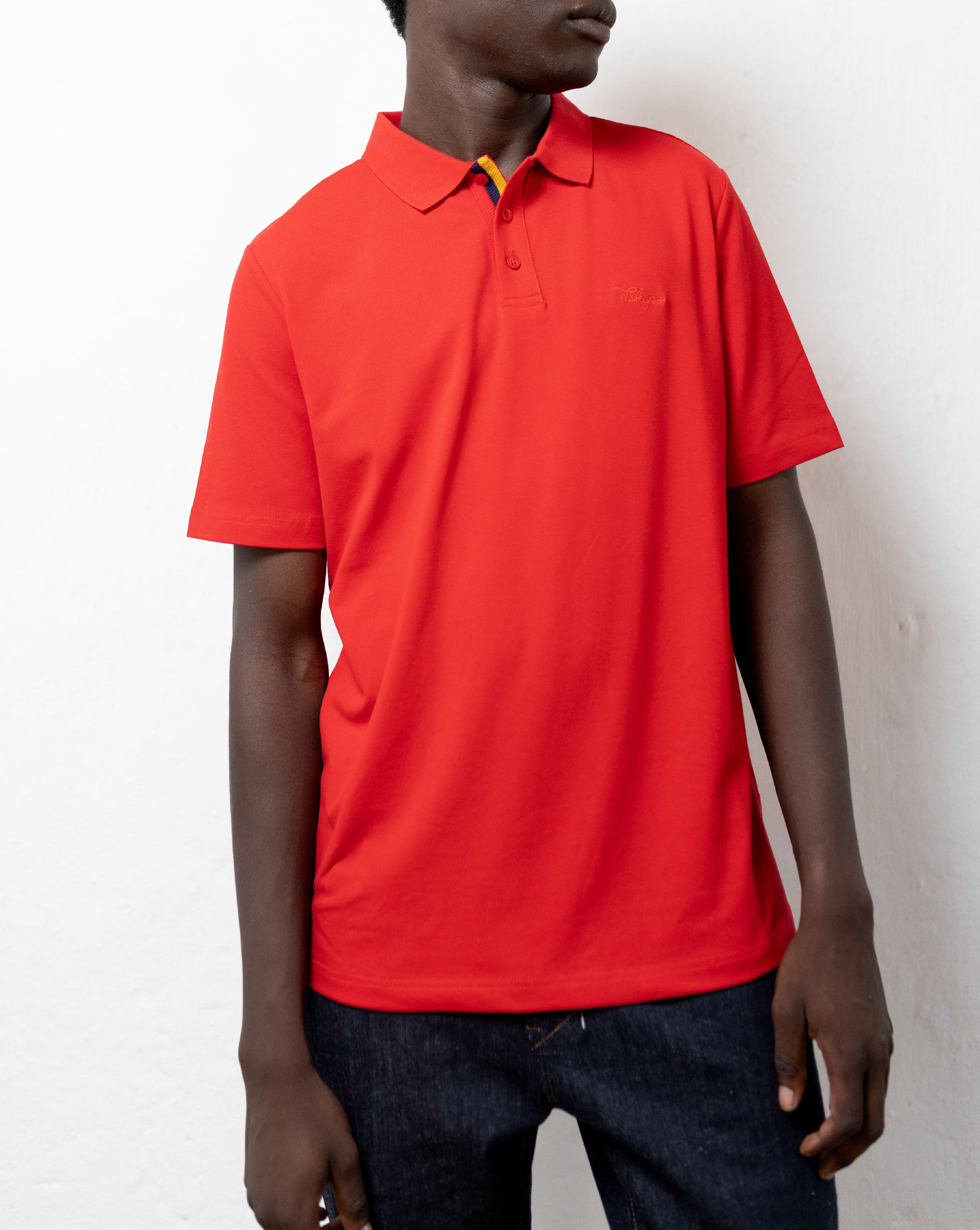 Model wearing the red TSHEPO Golf Shirt