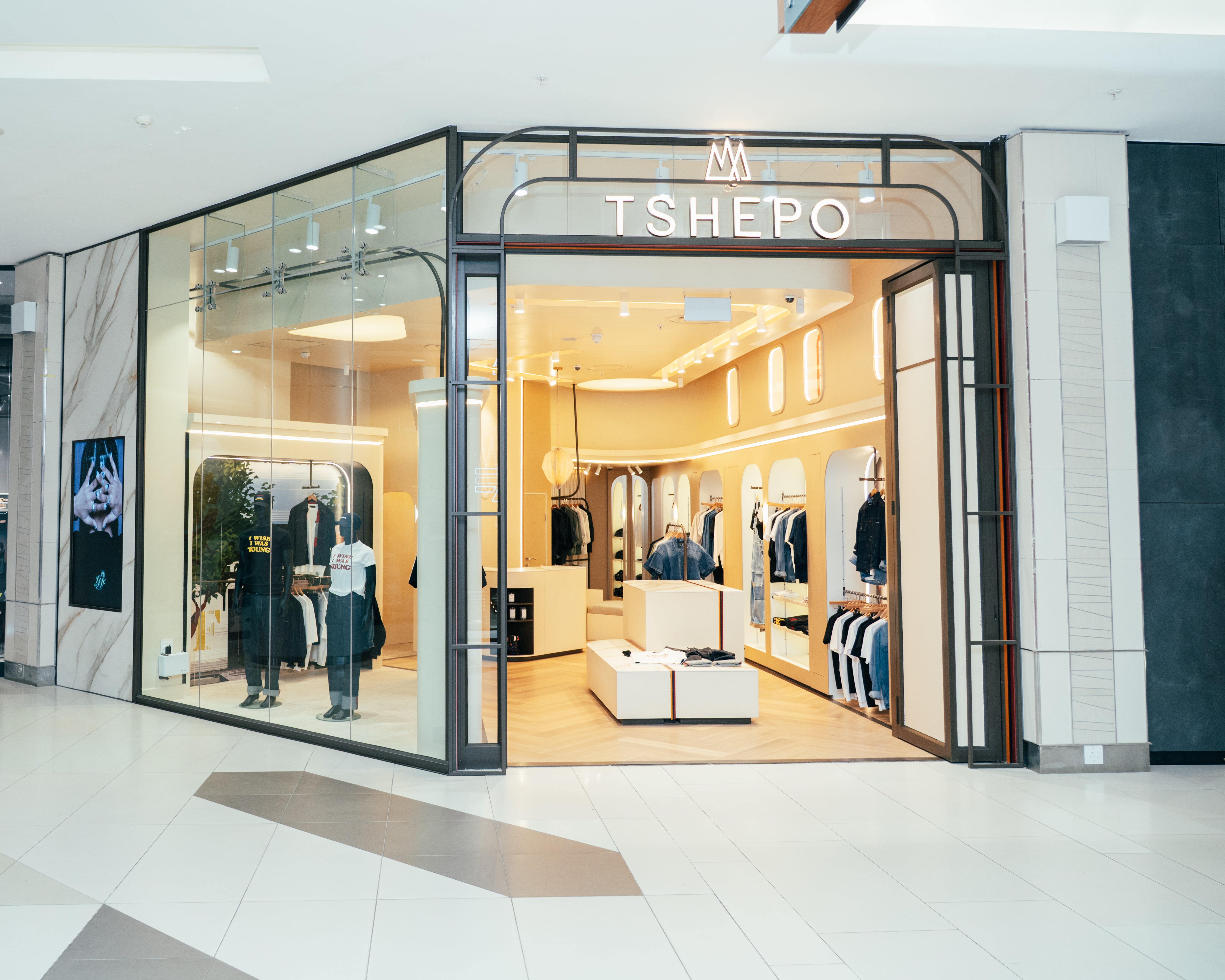 TSHEPO store front with clothing display inside a mall