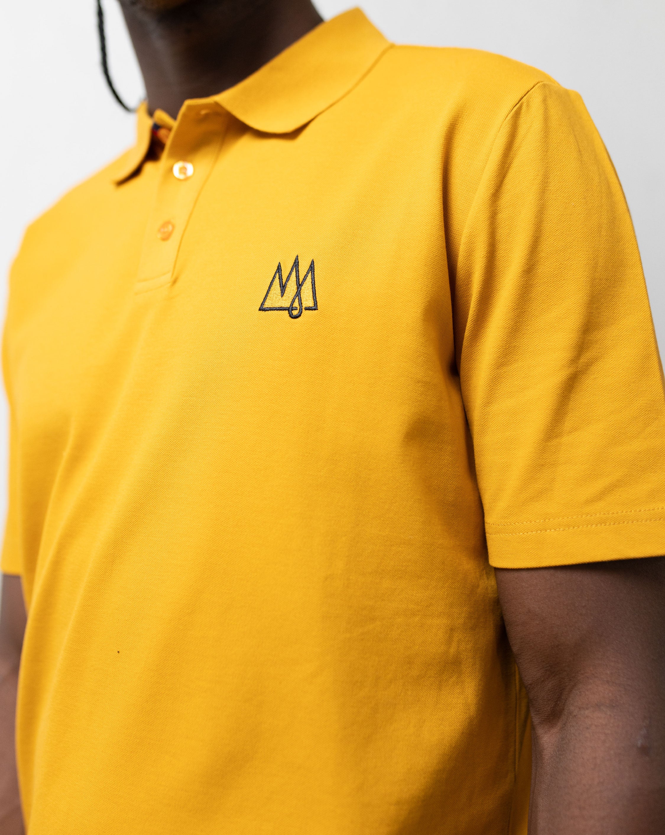 Model in a yellow TSHEPO Jeans Polo shirt