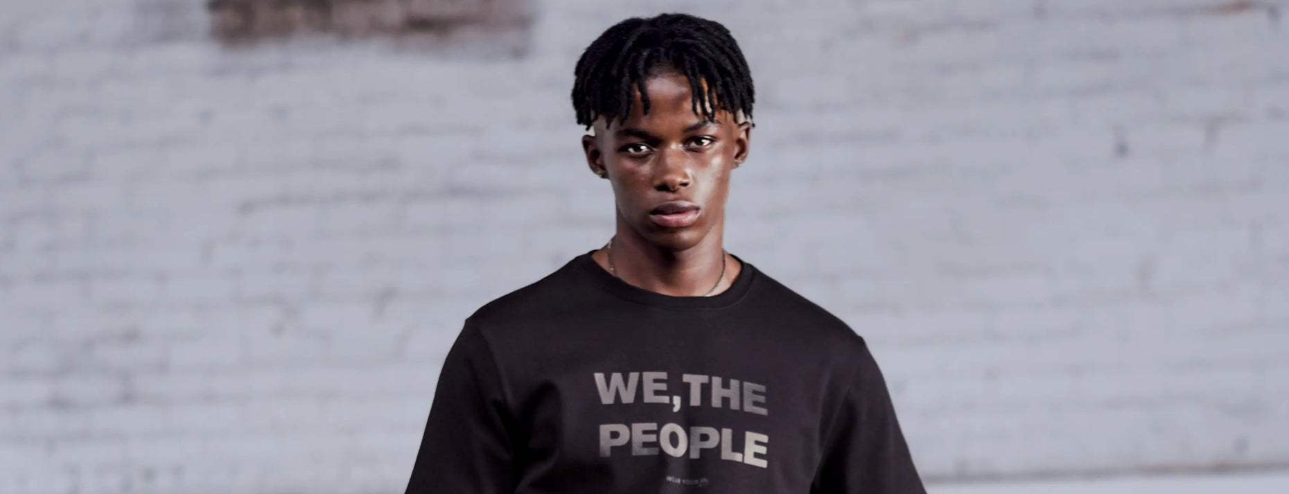 Model Wearing the new TSHEPO WE THE PEOPLE DOUBLE BLACK T-SHIRT