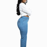 A SIDE PROFILE IMAGE OF A MODEL WEARING A LIGHT WASH PAKISHA
