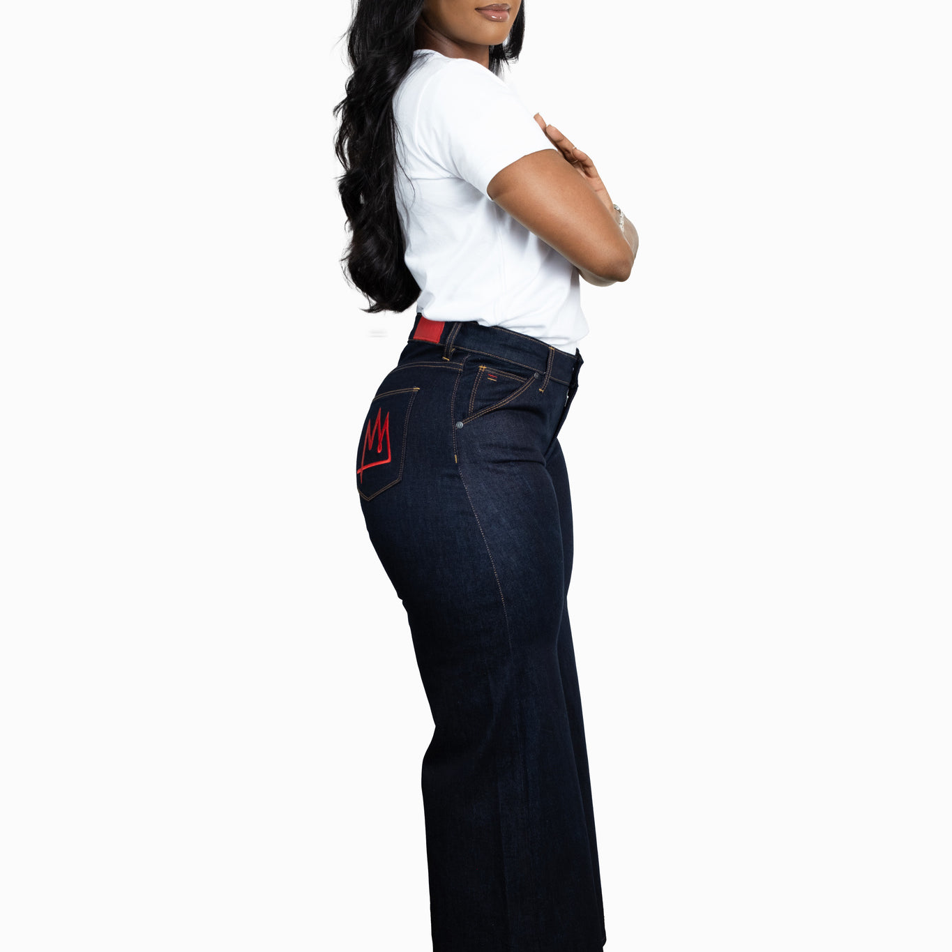 A side profile image of a model wearing the TSHEPO Pakisha Raw Jean